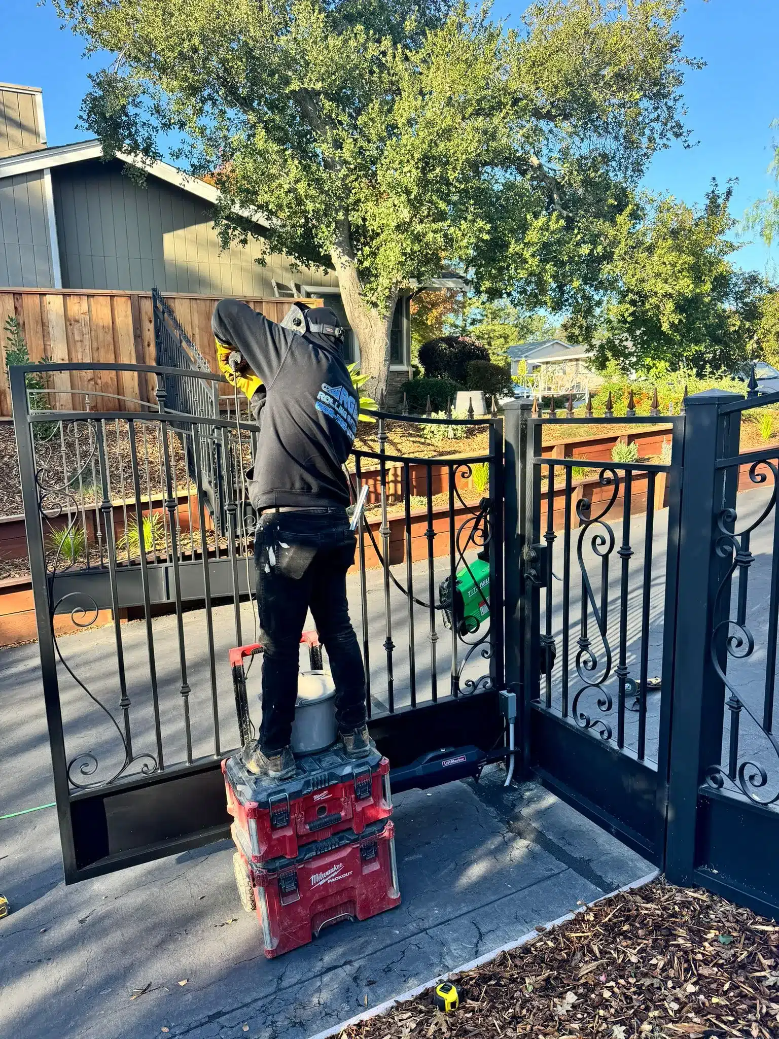 Photo Of A Technician On Red Boxes Welding A Wrought Iron Gate To Learn How To Fix A Sagging Gate
