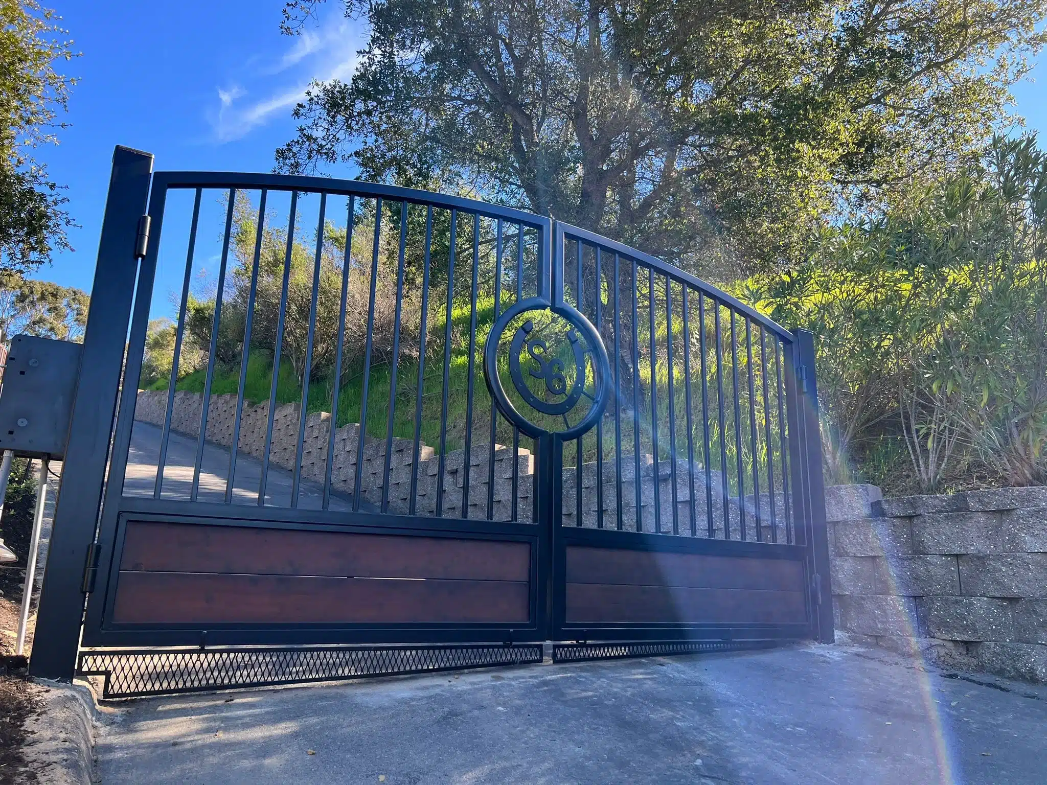Photo Of Custom Black Metal Dual Swing Gate Showing Pros And Cons Of Automatic Driveway Gates